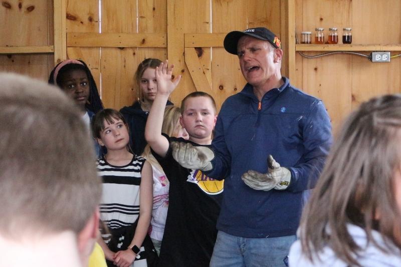 SES 5th grade teacher Jonathan Chaddock gives a tour to students in the SES Sugar Shack.