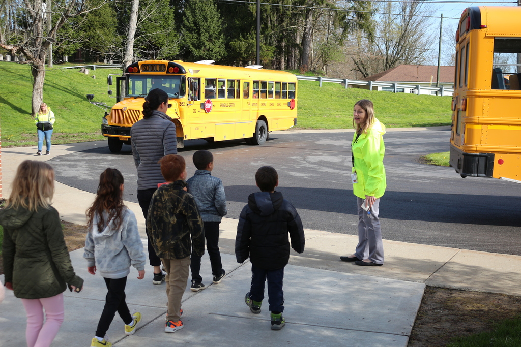 Students walk out to a bus drill at Colden Elementary School.