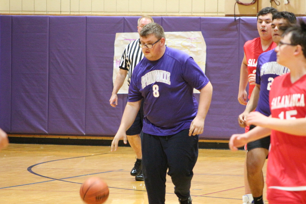 A student dribbles the ball during Thursday's unified basketball game at SGI.