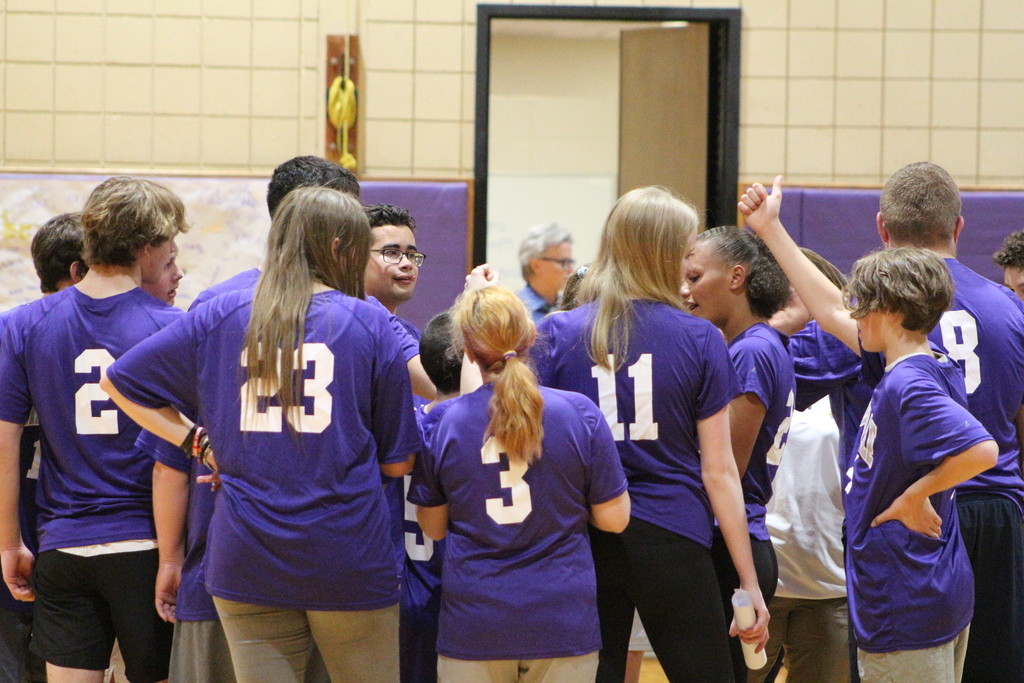 Students gather in a huddle during a unified basketball game.