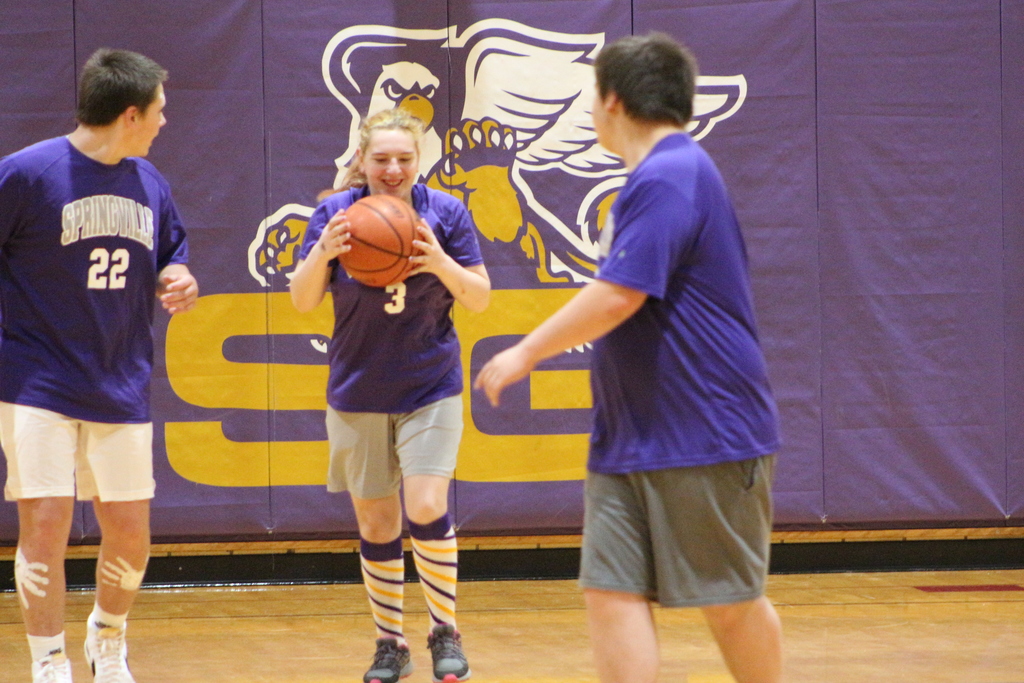 A student dribbles the ball during Thursday's unified basketball game at SGI.