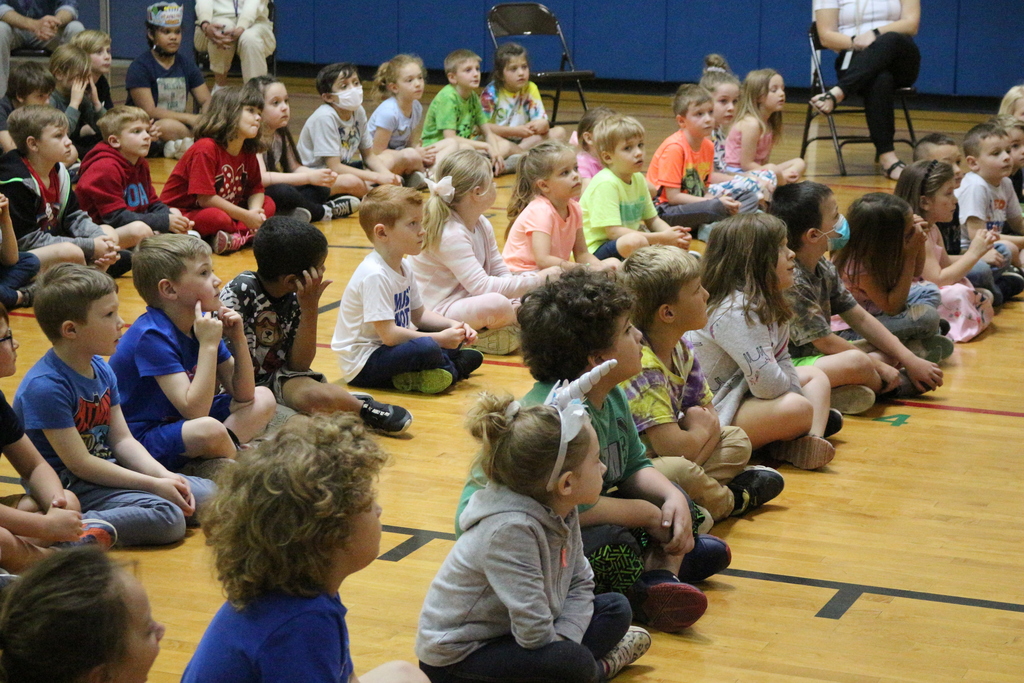 Students listen to a presentation to Hawk Creek Wildlife Center. 
