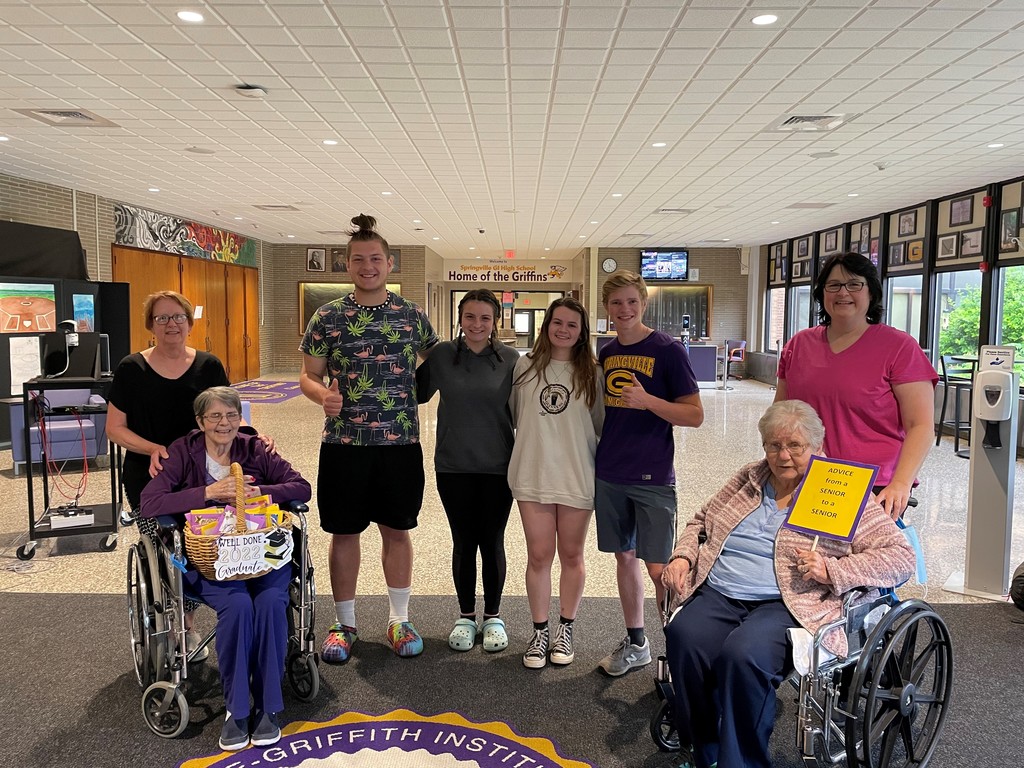 SGI students and seniors from the Jennie B. Richmond Nursing Home stand together in the main foyer at Springville High School.